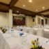 The Payogan Villa Resort and Spa Ubud meeting room with banquet tables and white chair covers