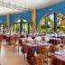 Time Coral Nuweiba Resort restaurant with arched windows and set dining tables in Nuweiba