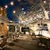 Gravity Haus Steamboat patio with string lights, outdoor tables and heaters in Steamboat Springs