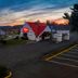 Red Roof Inn Warrenton exterior at sunset with illuminated sign and parking lot in Warrenton