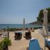 Pension Ageliki in Platis Gialos with sea-view sun loungers and umbrellas by the beach