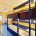 Bed’nBudget Expo-Hostel Dorms in Hannover, bunk beds and a small desk in a bright dorm room