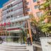 Ruizhao Hotel (Beijing Guomao Branch) in Beijing with glass entrance, steps, and multi-story facade