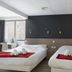 Lille City Hotel in Lille guest room with two twin beds and large windows