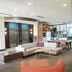 Holiday Inn & Suites Phoenix Airport lobby with seating area, elevator doors and café counter