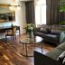 Åsby Hotell in Hallstahammar lounge with leather sofas, glass coffee table, desk and chandelier