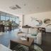 Avala Resort & Villas, Budva lounge with sea-view windows and balcony overlooking the old town