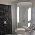 ibis Caen Porte de Bretagne bathroom with illuminated mirror, sink, shower and toilet in Bretteville-sur-Odon