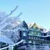 Berg & Spa Hotel Gabelbach in Ilmenau amid snow-covered trees and alpine-style buildings