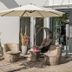 B&B Villa Verde in Salzburg patio with wicker chairs, umbrella, and glass doors