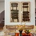 Le Moulin, Lourmarin lounge with sofa, coffee table, framed chair artwork and dried flowers