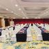 Xinji Garden Hotel in Nanchang ballroom set for a conference with rows of white-covered chairs and tables