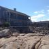 Bearskin Neck Motor Lodge in Rockport with oceanfront rocky shoreline and waterfront building