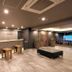 Hotel Route-Inn Kitamatsudo Ekimae lobby with front desk, seating, and modern lighting in Matsudo