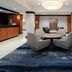 Fairfield Inn & Suites by Marriott Seattle Bremerton lobby seating area with round table and blue rug in Bremerton