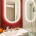 ibis Aulnay Paris Nord Expo bathroom with sink, backlit mirror and glass shower in Aulnay-sous-Bois