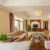 Jingland Exhibition Hotel in Xishuangbanna living room suite with sofa seating and balcony view
