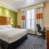 Fairfield Inn & Suites by Marriott Alamogordo guest room with king bed, desk and tall window