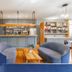 Hôtel Spa De La Citadelle Lorient lounge with bar, blue armchairs and wood floors in Port-Louis