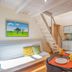 Boutique Hotel Fortino Chania room with loft ladder, sofa bed, dining table and kitchenette
