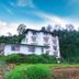 Ashley Resort in Nuwara Eliya beside lush hills and a waterfall