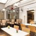 Lille City Hotel, Lille: bright hotel breakfast room with tables and high chairs under skylights