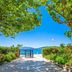 Haraki Mare Studios & Apartments in Rhodes with a seaside path, trees, flowers and blue water view