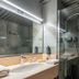 Hôtel Le Yachtman, The Originals Collection bathroom with sink vanity and glass walk-in shower in La Rochelle