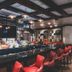 Cannery Casino Hotel in North Las Vegas bar lounge with red stools and backlit bottles
