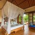 Amertha Bali Villas in Gerokgak: canopy bed and lounge daybed with open tropical views