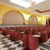 Playacartaya in Cartaya: theater-style hall with red chairs, checkered floor, and stage with pirate backdrop