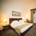 Vila Gale Ericeira, Mafra: guest room with double bed, desk, TV, and balcony doors