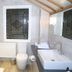 The Old Railway Station, Petworth: bright bathroom with walk-in shower, sink, toilet and stained-glass window