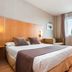 Posadas De España Cartagena guest room with double bed, desk, sofa, and window view in Cartagena