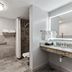 AmericInn by Wyndham Wisconsin Dells bathroom with accessible toilet, shower, and sink