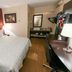 Red Roof PLUS+ Nashville South - Fairgrounds guest room with king bed, desk, and vanity