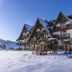Silverton in Białka Tatrzańska, snowy alpine-style hotel exterior under a clear blue sky