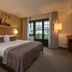 Fletcher Hotel-Restaurant De Klepperman room in Hoevelaken with a king bed and large window