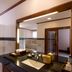The Payogan Villa Resort and Spa Ubud bathroom with vanity, large mirror and tiled walls