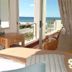 Diaz 15 House on The Bay, Jeffrey’s Bay: room with balcony and ocean view through open doors