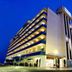 Tahití Playa Suites in Santa Susanna, modern hotel exterior at dusk with illuminated balconies