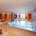 Montebelo Viseu Congress Hotel in Viseu indoor pool with loungers and large windows