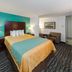 Sunset Motel Hood River room with king bed, sofa seating and desk in Hood River