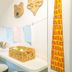 Hotel Melo in Balneário Camboriú: bright guest workspace with desk, chairs, wicker basket and wall decor