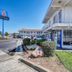 Motel 6-Vallejo, CA - Six Flags West exterior with parking lot, walkway and balcony in Vallejo