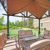 Staybridge Suites Knoxville Oak Ridge By IHG patio seating area with umbrella and landscaped grounds