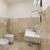 Hotel San Francisco in Dorgali bathroom with bidet, wall-mounted toilet and shower head