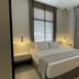 Palladion Boutique Hotel in Árgos, modern guest room with bed, bedside lights, window blinds and curtains