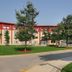 Residence & Conference Centre - Oakville exterior with red-roofed hotel and landscaped driveway