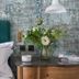 Cotswold Plough Hotel & Restaurant in Bampton guest room with teal headboard, bedside flowers and lamp